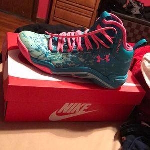 Blue and pink under amour basketball shoes